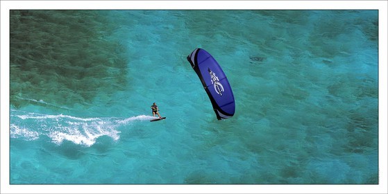 Kitesurf - Tobago Caies - GrenadinesProduct: in house made quality print on 8 ultrachome colors Epson ink Jet printer.Available sizes: . 50 x 100 cm. 100 x 200 cmAvailable papers: . Standard 250 gr glossy paper print, black streak, white margin, no signature. Top quality glossy 290 gr. paper, black streak, white margin, checked and signed by the author. Fine Art print (signed, numbered, stamped, registered) on demand. Other supports (Canvas, Acrylic, Metal) on demandPackaging: cylindric reinforced tubeShipping options: regular mail or Shipping companyClick on the basket icon to select your options and start the online ordering process
