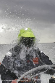 Orange II  - 2005 Jules Verne Trophy - Training in Bay of Biscay - Lionel Lemonchois + helmsan strong wind helmett-