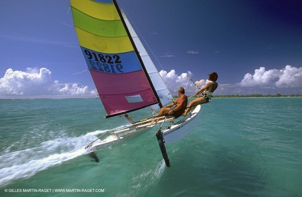 sailing catamaran in blue waters